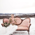 styled-fur-bride-on-vintage-couch-outdoors-in-field