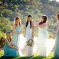 bridesmaids attend to bride dress