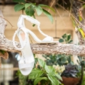 white satin heels on tree branch