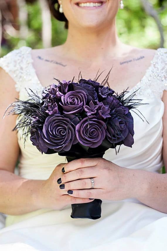 Gothic bridal bouquer with black feathers and purple flowers