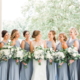 bridesmaids dusty-blue-gowns-matching-white-bouquets