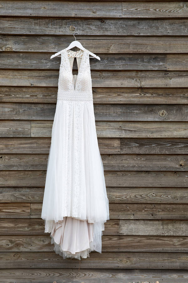 V-neck flowy wedding dress on hanger