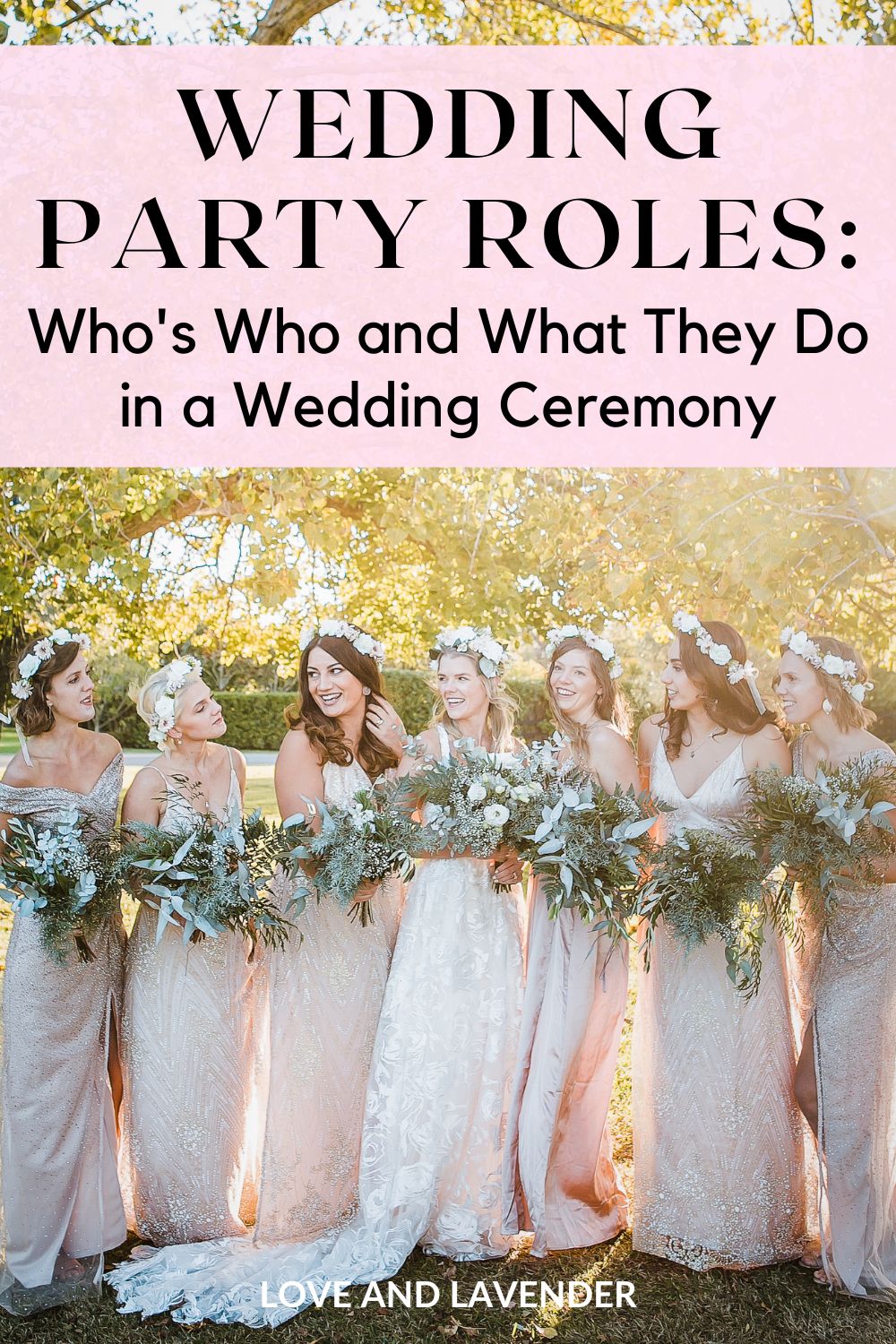 Seven women in matching light pink dresses and flower crowns stand outdoors holding bouquets, smiling and posing together beneath a tree. Text above reads, "Wedding Party Roles," highlighting their special wedding responsibilities.