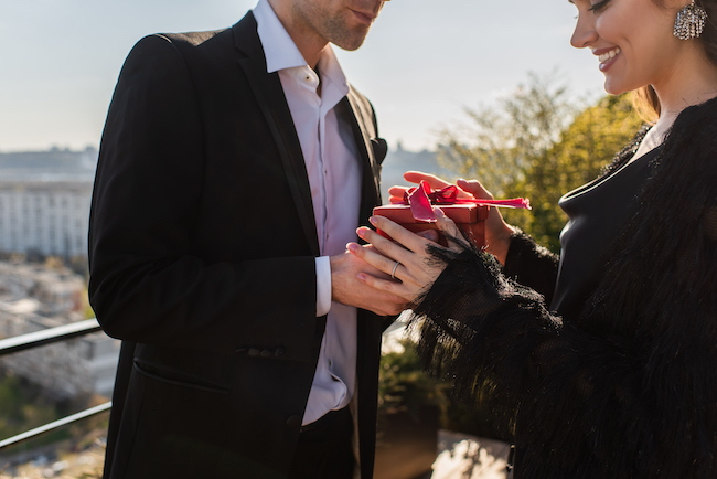 couple exchanging a gift