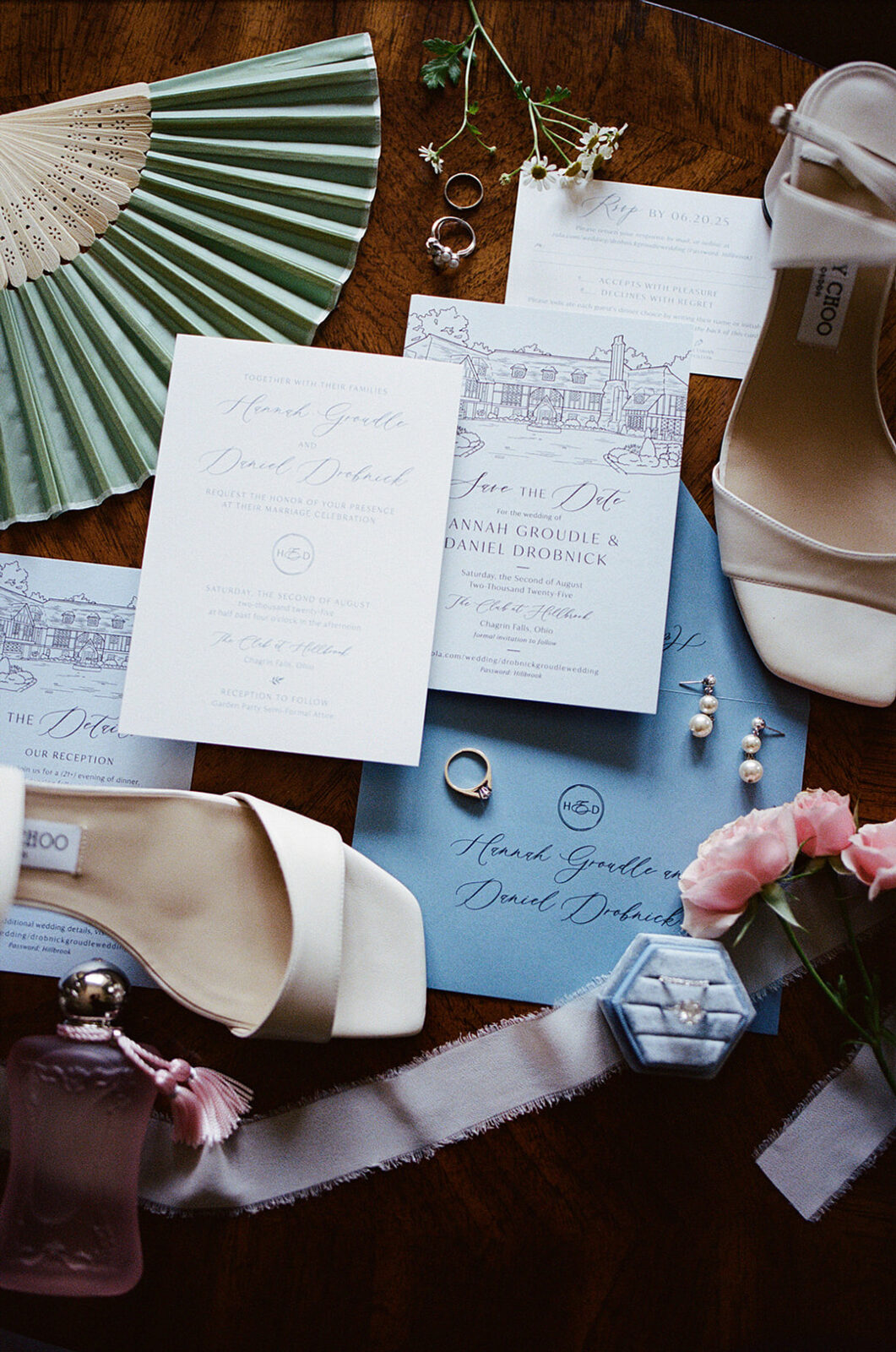 A wedding invitation cards and shoes.