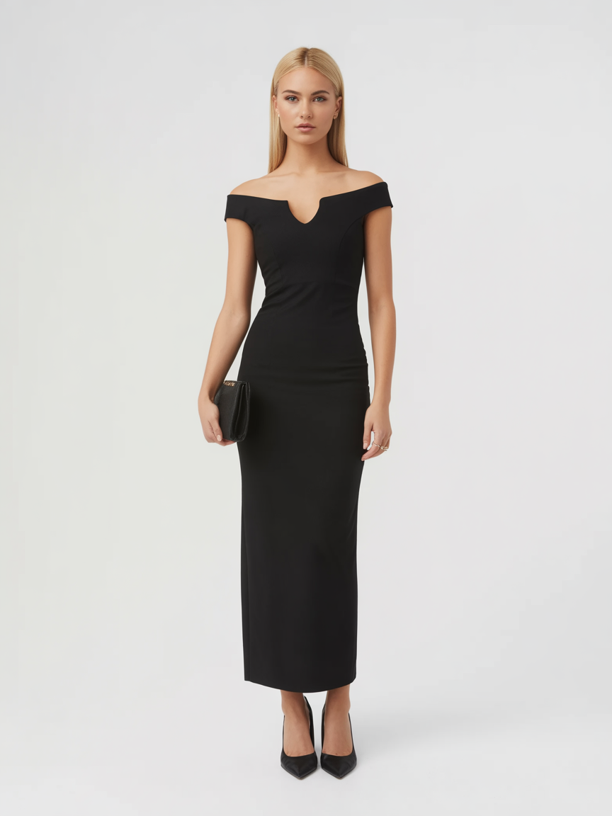 A woman stands against a plain background wearing a fitted, off-the-shoulder black dress, black heels, and holding a black clutch—an elegant choice perfect for cocktail parties or as a formal wedding guest dress.