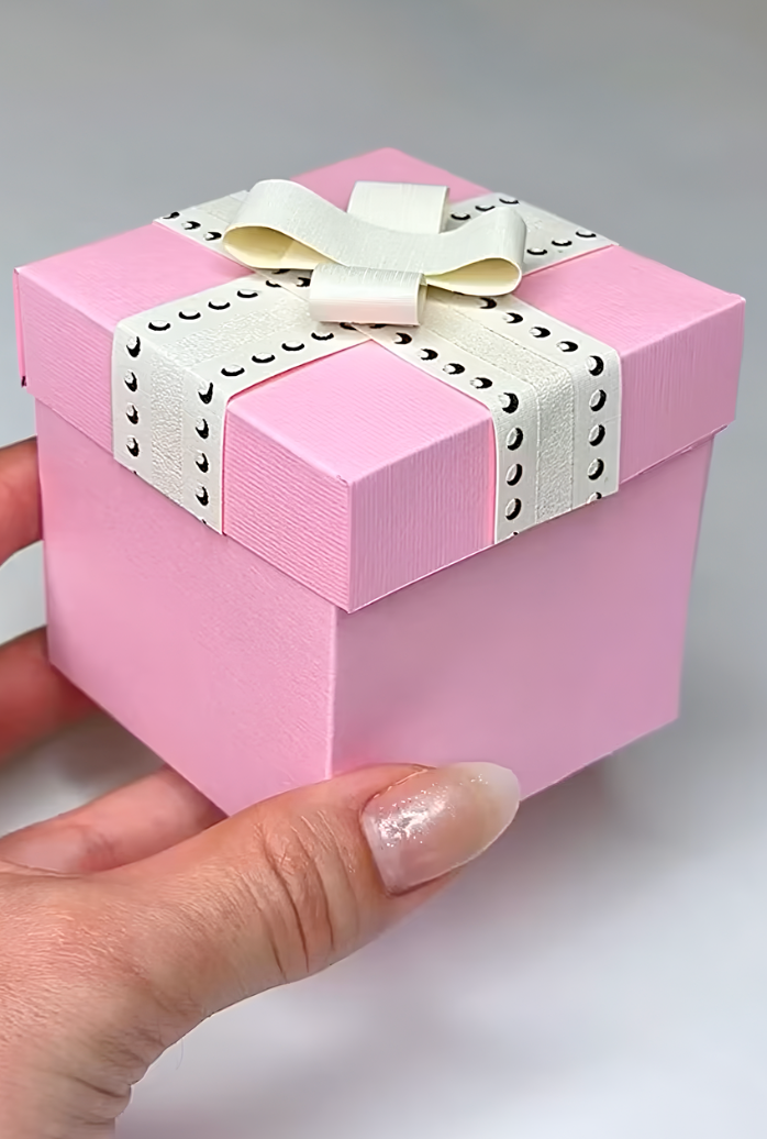 Miniature colored paper origami gift box