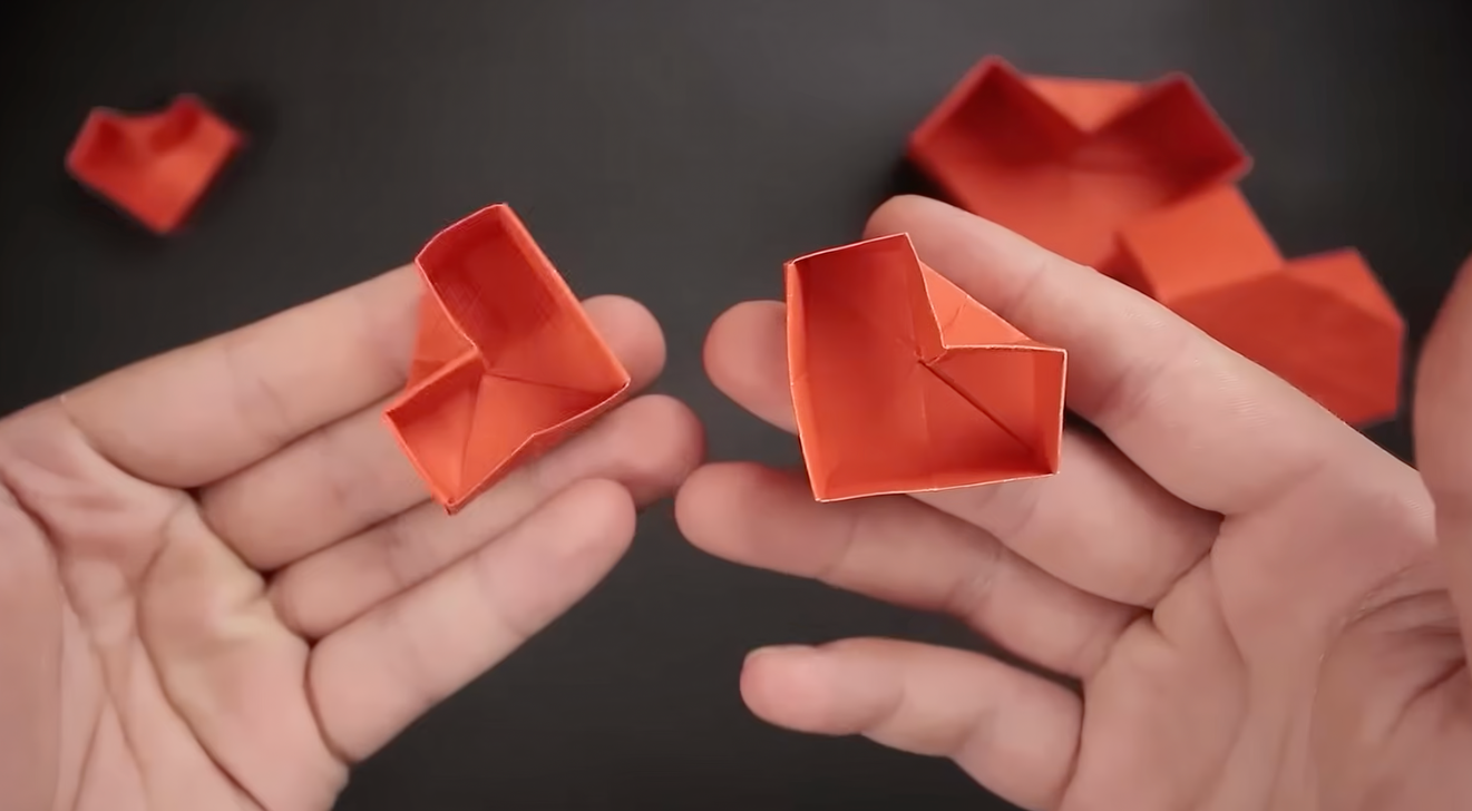 Elegant folded origami paper heart box with matching lid