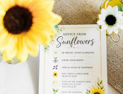 A card titled “Advice from Sunflowers” with motivational tips sits on a table decorated with sunflowers, daisies, and jars of honey.