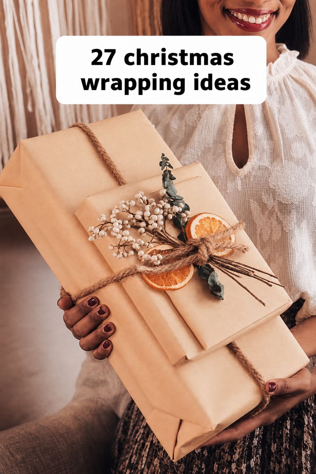 Woman holding two gifts wrapped in brown paper and twine, decorated with dried orange slices and sprigs. Text overlay reads “27 Christmas Wrapping Ideas.” Perfect for anyone searching for inspiring Christmas Gift Wrapping tips or looking to follow Step-by-Step Videos to create beautiful holiday packages.